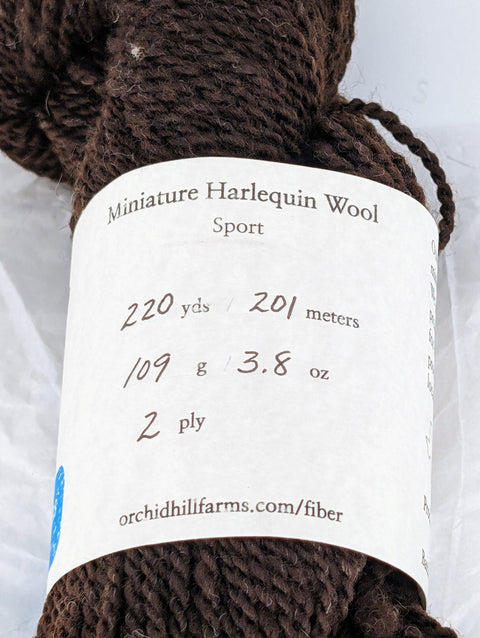 Yarn Batch 2023-016 is a Sport weight blend of Miniature Harlequin wool.