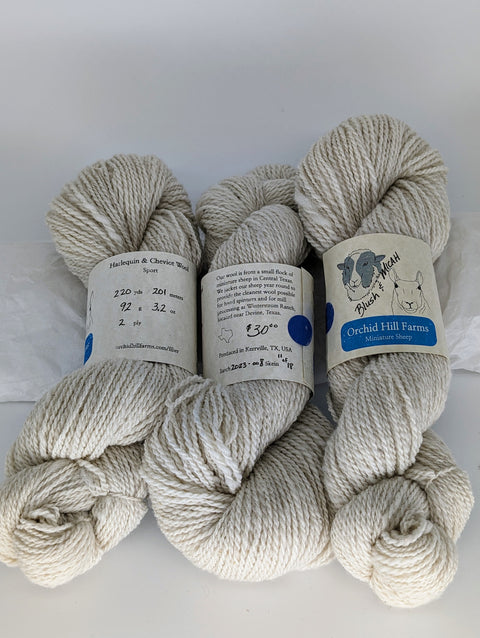 Yarn Batch 2023-008 is a Sport weight blend of Miniature Harlequin and Miniature Cheviot wool.